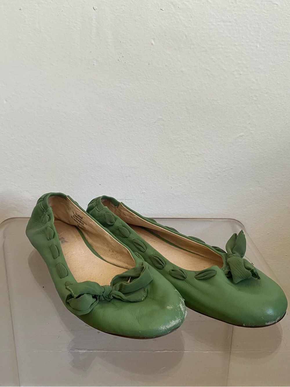 Green leather ballet shoes with  woven ribbon trim and bow